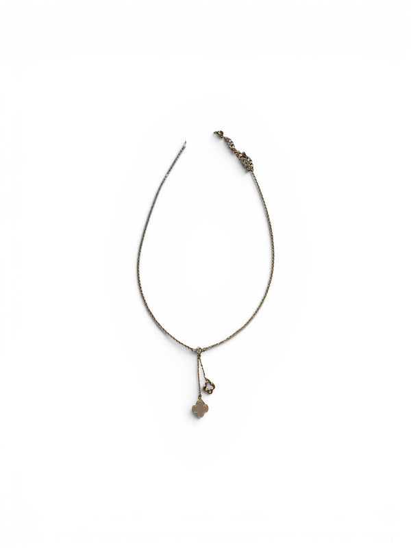 Tiny gold necklace with dangled clovers